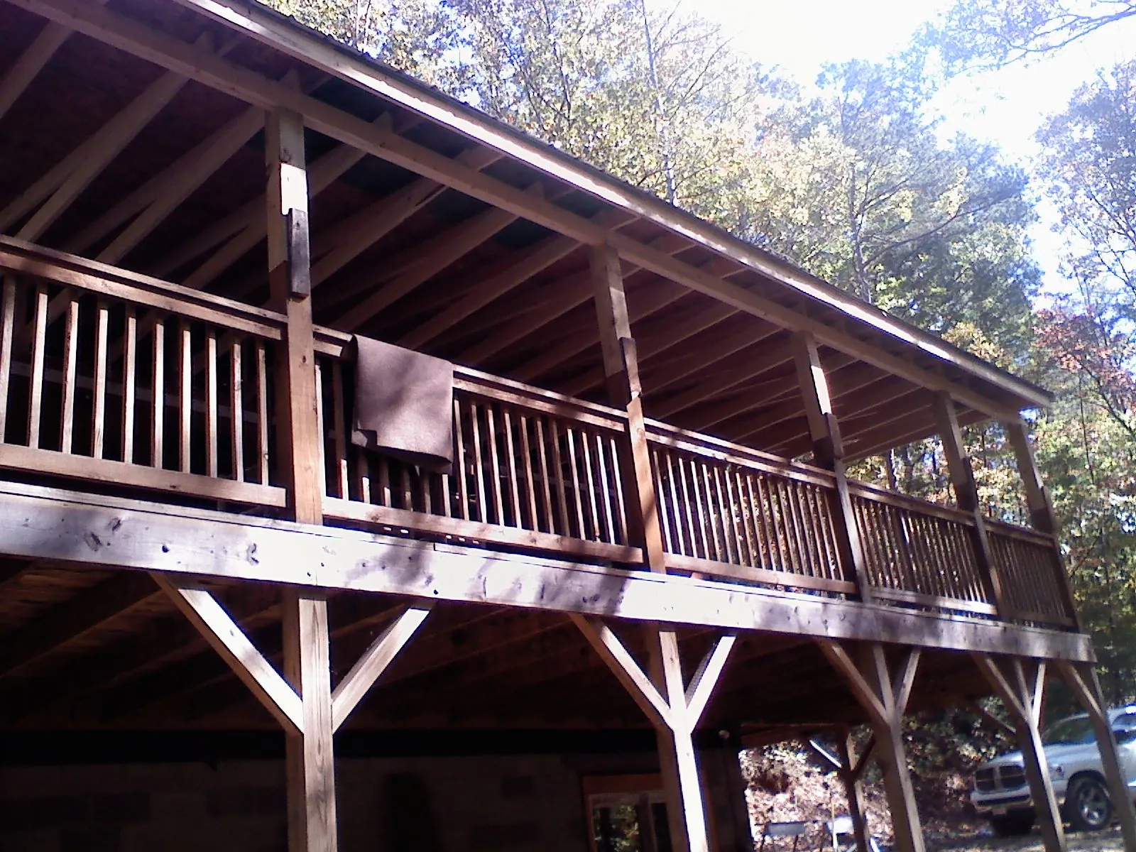 Timber framing under a new elevated porch and deck — Roof Leak Repair in Colorado City by Roofing Brothers